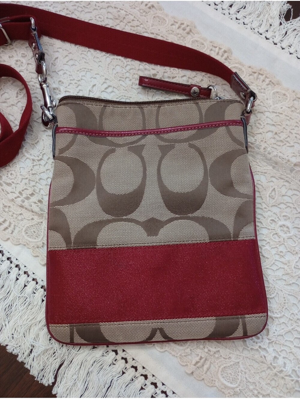 Coach signature C crossbody purse with red stripe and strap